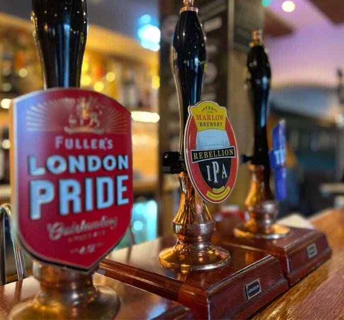 Pub bar showing london pride and rebellion IPA